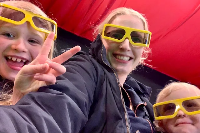 a family posing in 3D glasses at Marsh Farm