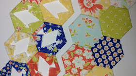 EPP hexies in Coney Island fabrics by Fig Tree & Co. for Moda