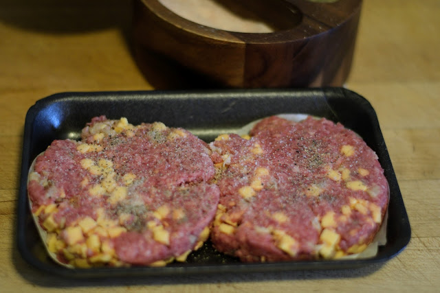 The bacon cheddar patties seasoned with salt and pepper. 