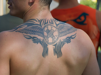 cross with wings tattoo. A beautiful tribal wing tattoo