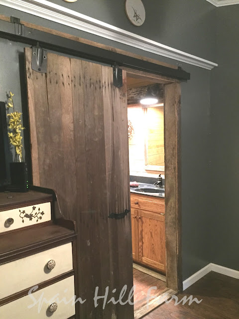 beautiful barnwood bathroom with reclaimed barn door