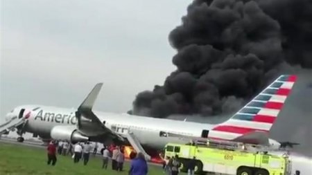 American Airlines plane catches fire at Chicago Airport, 8 injured