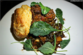 Slowly Braised Beef Cheek: Buttermilk biscuit, caramelized onion jam, collard greens