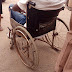 Impoverished wheel chair at NAUTH carrying an incapacitated man in anguish