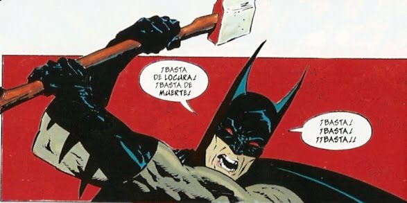 batman poniendo el mal a raya hacha en mano