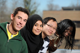 4 young people - 2 men, 2 women from different cultural backgrounds