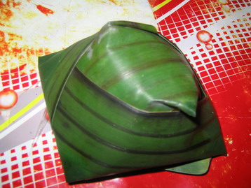 steamed grounded corn wrapped in banana leaves