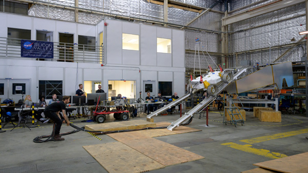 A snapshot of NASA's VIPER lunar rover prototype, known as MGRU3 (Moon Gravitation Representative Unit 3), conducting an egress test at the Ames Research Center in California's Silicon Valley.