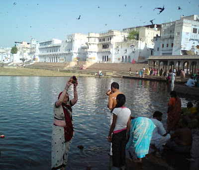 Offering water to the Sun God at the Pushkar Lake