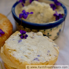 close up pic of wild violet butter spread on a biscuit