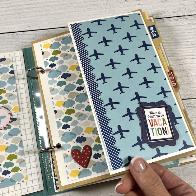Travel Scrapbook Album Page with a folding element, airplane pattern paper, and lots of pretty clouds