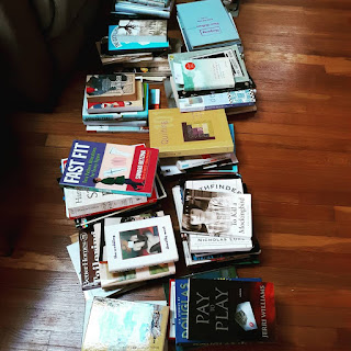 All of my books arranged on the floor