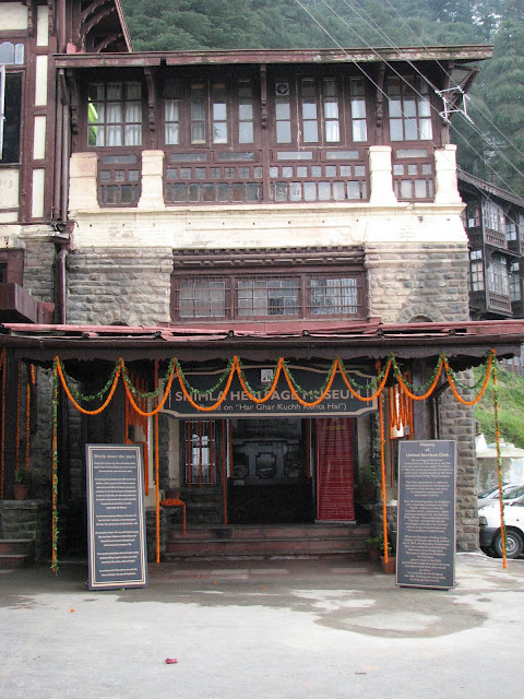 Shimla Heritage Museum: An eye opener for touristsVandana Bhagra, ShimlaPhotos: By me History can be interesting as well as inspiring and when coupled with life-size images it adds colour to ones imagination. And rather than leaving things to imagination the state tourism department has given shape to it in form of the recently inaugurated ‘Shimla Heritage Museum’ based on the concept of ‘har ghar kuch kehta hai’. Taking a step further this museum is housed in the 120 year old building which is prevalently known as the US Club dating back to almost 1860s, which has been renovated on similar line to the original structure to preserve its wholesomeness. As you enter the building you are reminded of Shimla down the years and a brief write up on the history of the United Service Club is good for enlightenment. The not so huge room inside, though just an attempt to capture the history of Shimla, holds nearly 50 huge portraits and sketches of Shimla dating to the Colonial period. Old timers can definitely associate with all the old building but the young and those visiting for the first time will be left mesmerizing with the beauty and legacy of Shimla. Some of the rare photographs adorning the walls include pictures of magnificent buildings such as the Viceregal Lodge, Rippon Hospital, Post Office, Town Hall, Gaiety Theatre, Combermere Bridge, Vidhan Sabha, Gorton Castle, Railway Board, Central Telegraph Office, the ARTRAC Complex and Barnes Court to name a few. Below the black and white sketches you can see the originals in coloured to give you a feel of the present day.  Dr Arun Sharma, Director Tourism and Civil Aviation says “Though at present we have very limited space, expansion plans are on anvil as and when we are provided with more space. An attempt has been made to re-discover Shimla's soul and through this museum we wish to fulfill the curiosity of the visitors. Heritage walks, timely tours, a training centre for tourists guides as well as related tourist activities would be taken up simultaneously”. He adds it is time that the heritage status of Shimla is used to maximize economical gains as well as use innovative methods to attract more and more tourist to the states and also prolong their stay. Sharma said, “The department has started the Shimla City Tour in association with the Tourism Industry Stakeholders Welfare Society, Shimla through which heritage walks would begin in the city”. Taking this concept further he says, “We are planning on adopting one village in each district which will be promoted as a tourist destination by opening similar kinds of museums eerywhere”.Surender Justa, District Tourism Development Officer, added that this is just a beginning of better things to come. “Initiatives are being taken to promote this museum as well as Shimla City as a heritage destination. Banners and signage’s are being put up on the streets to inform the tourist about this place. At the same time guides are being given training to help tourists. Despite the fact that it is just a one room museum, expansion plans are on”.In spite of the fact that this museum is a one room show but perceptions and insights will definitely change once you walk around. You may have heard stories about the old ‘tongas’, the ‘rikshaw’ or the styles and glory in which the Britishers lived, which you can easily picturize through the portraits and sketches placed here. A must stop over to complete your visit to Shimla and take some amazing memories.