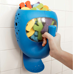 wall-mounted pail for bath toys, shaped like a whale