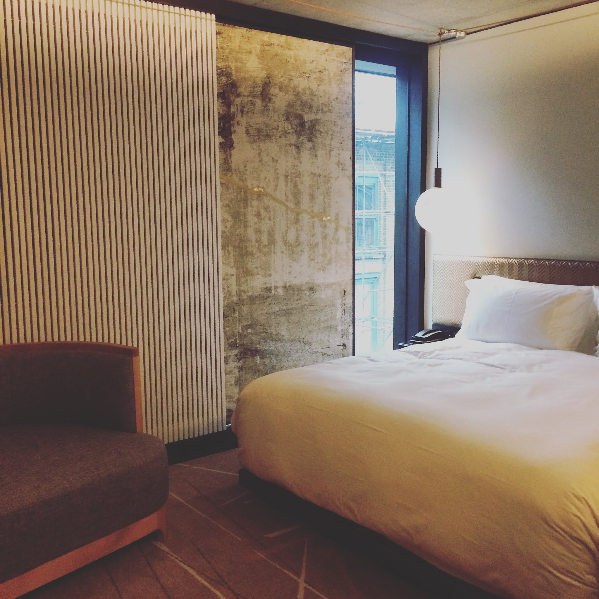 bedroom with white sheets at nobu hotel shoreditch