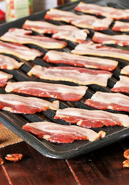 Uncooked Bacon Strips on Broiler Pan Image