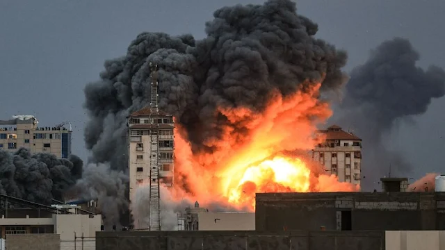 Cover Image Attribute: People standing on a rooftop watch as a ball of fire and smoke rises above a building in Gaza City on Oct. 7, 2023, during an Israeli airstrike that hit the Palestine Tower building. / Source: MAHMUD HAMS/AFP via Getty Images
