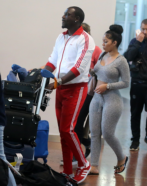 Akon steps out with one of his wives in France (photos)