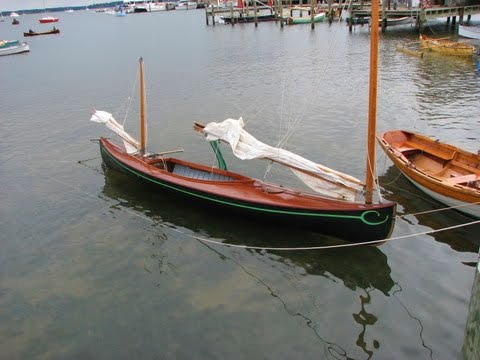 haven't been able to identify these two decked sailing canoes