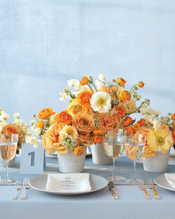 Modern Centerpiece Bright bunches of sweetpeas poppies roses ranunculus 