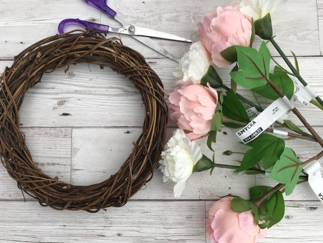 Rattan wreath, flowers and scissors