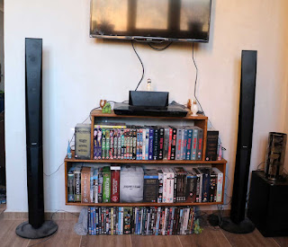 DVD storage attached to the wall and filled