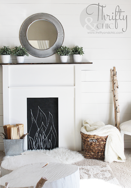 DIY faux fireplace surround and mantel. Made for under $50, would be perfect with stockings for the holidays!