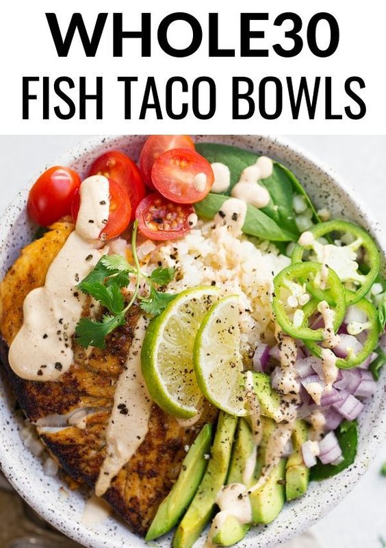 Whole30 Fish Taco Bowl - An easy to make Whole30 compliant lunch or dinner recipe. Paleo fish taco bowl served on a big bed of cauliflower rice and topped off with a raw cashew, creamy chipotle sauce.
