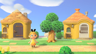 two yellow houses in a row and my female avatar in yellow fairy dress and some black bunny ears, looking like bee