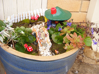 Our fairy garden is complete!