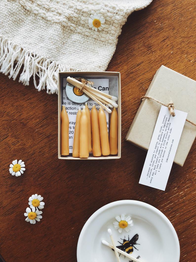 small candles on a cardboard box