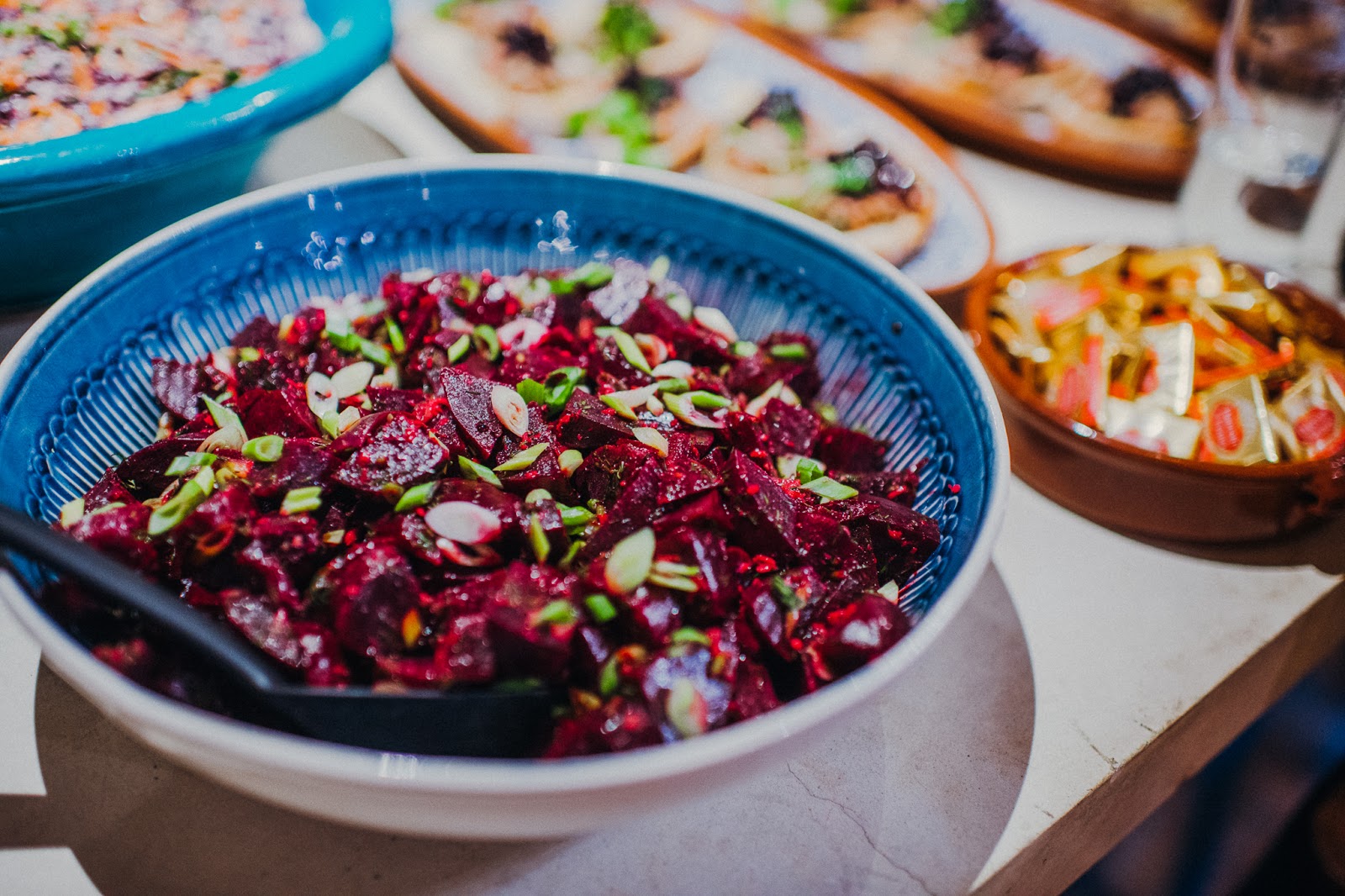 Beetroot salad in a blue bowl.