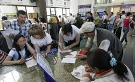 moldova citizens queue to apply for visas to escape the communist government