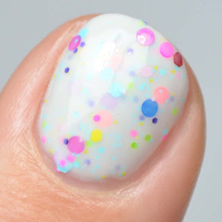 white crelly nail polish with neon glitter