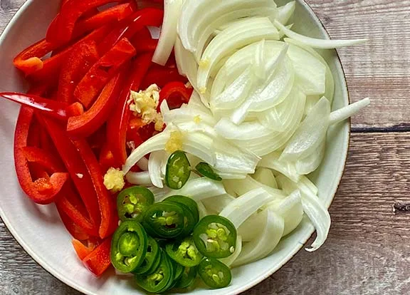 Sliced peppers, onion, garlic and green chilli.