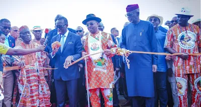 Gov. Okowa cutting the tape for the inauguration in Uyo