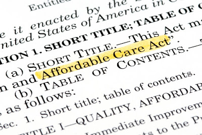 A close-up photo of the Affordable Care Act document.