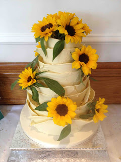 White Chocolate Wedding Cake decorated with Sunflowers - The Yummy Cake Company