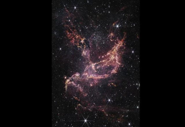 Imagen tomada por el James Webb de un cumulo de estrellas llamada NGC 346