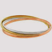 three gold bangle