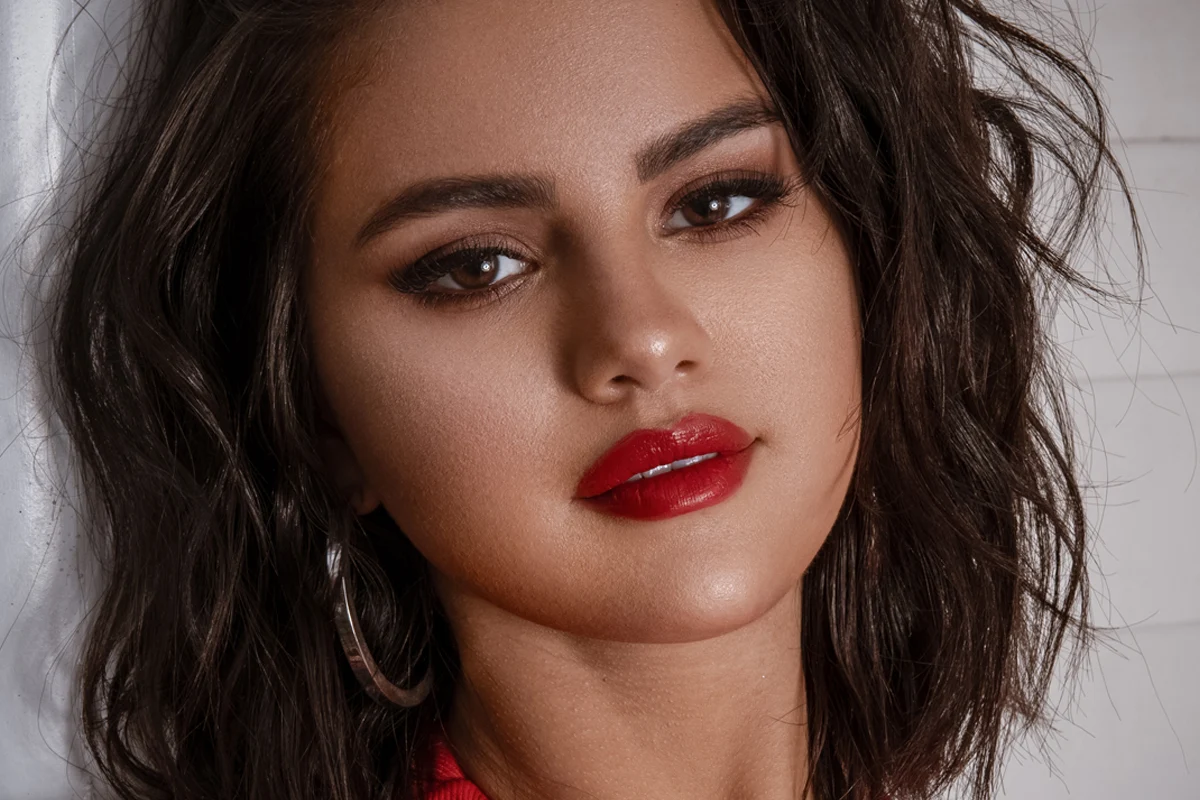 a close-up portrait of Selena Gomez with messy, shaggy hair