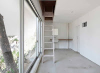 Japanese Vertical House Design Boasts Different Sized Windows and Openings