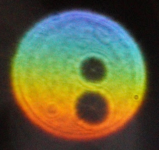 green-orange orb with two holes