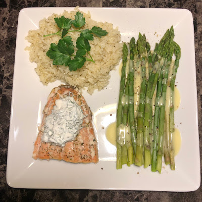 Salmon with lemon dill cream sauce, cilantro lime rice and asparagus with hollandaise