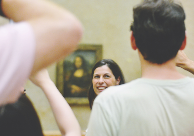 Tourist taking selfie at Mona Lisa