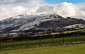 Photo of another view of snow on the hills