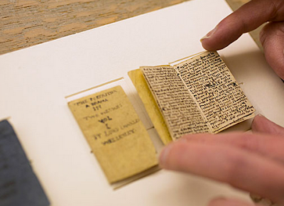 http://www.openculture.com/2014/07/13-year-old-charlotte-bronte-her-brother-wrote-teeny-tiny-adventure-books-measuring-1-x-2-inches.html