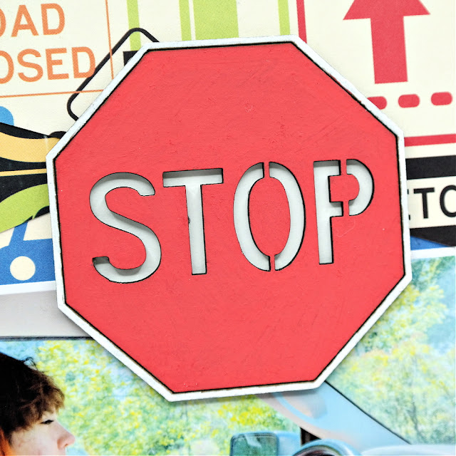 Hand-painted chipboard stop sign embellishment on a teen driving scrapbook layout.