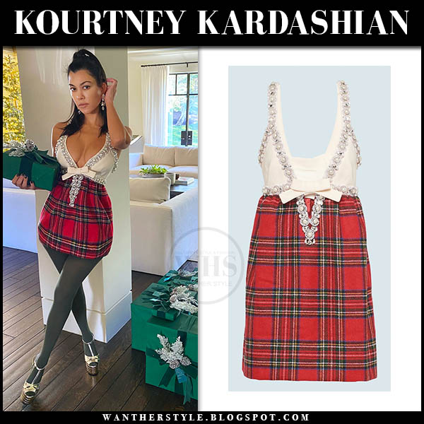 Kourtney Kardashian in red plaid mini dress and silver sandals