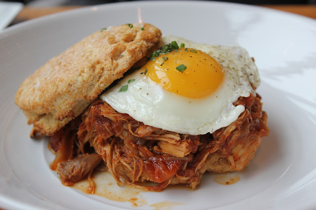 Buttermilk biscuit with barbecued pulled chicken and fried egg at Catalyst, Cambridge, Mass.